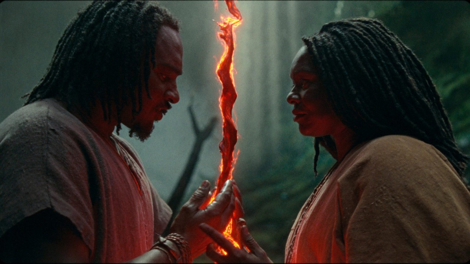 A glowing red thread of fire stretches through the dark between two figures facing each other